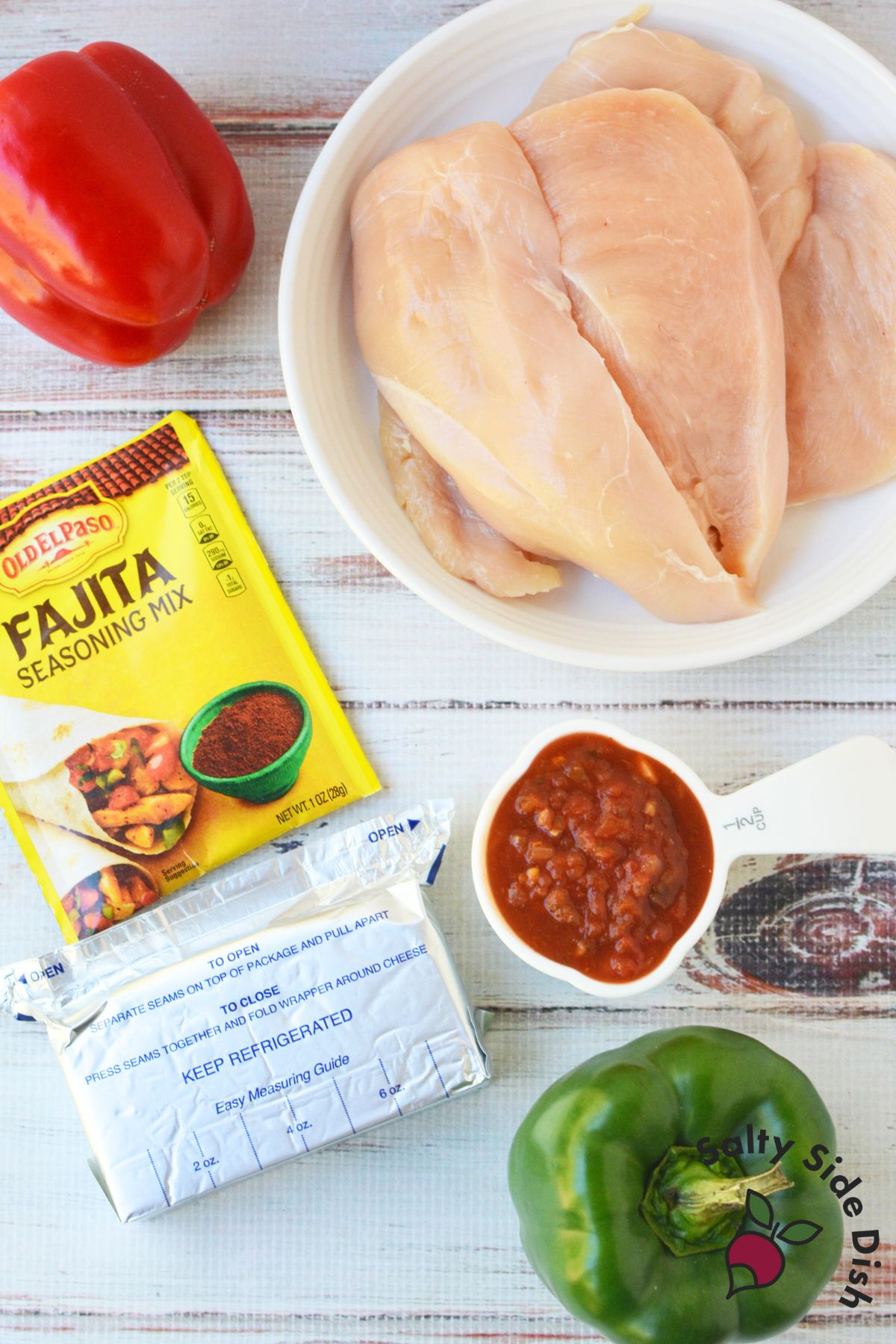 Chicken fajita bake ingredients including raw chicken breasts, fajita seasoning mix, salsa, cream cheese, and bell peppers