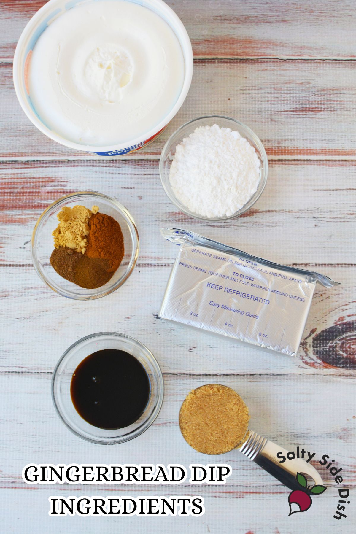 Overhead photo of gingerbread dip ingredients including cream cheese, whipped topping, molasses, brown sugar, powdered sugar, and spices.