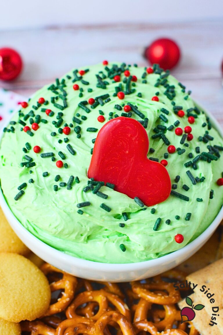 Whoville holiday dip topped with a large red candy heart and Christmas sprinkles