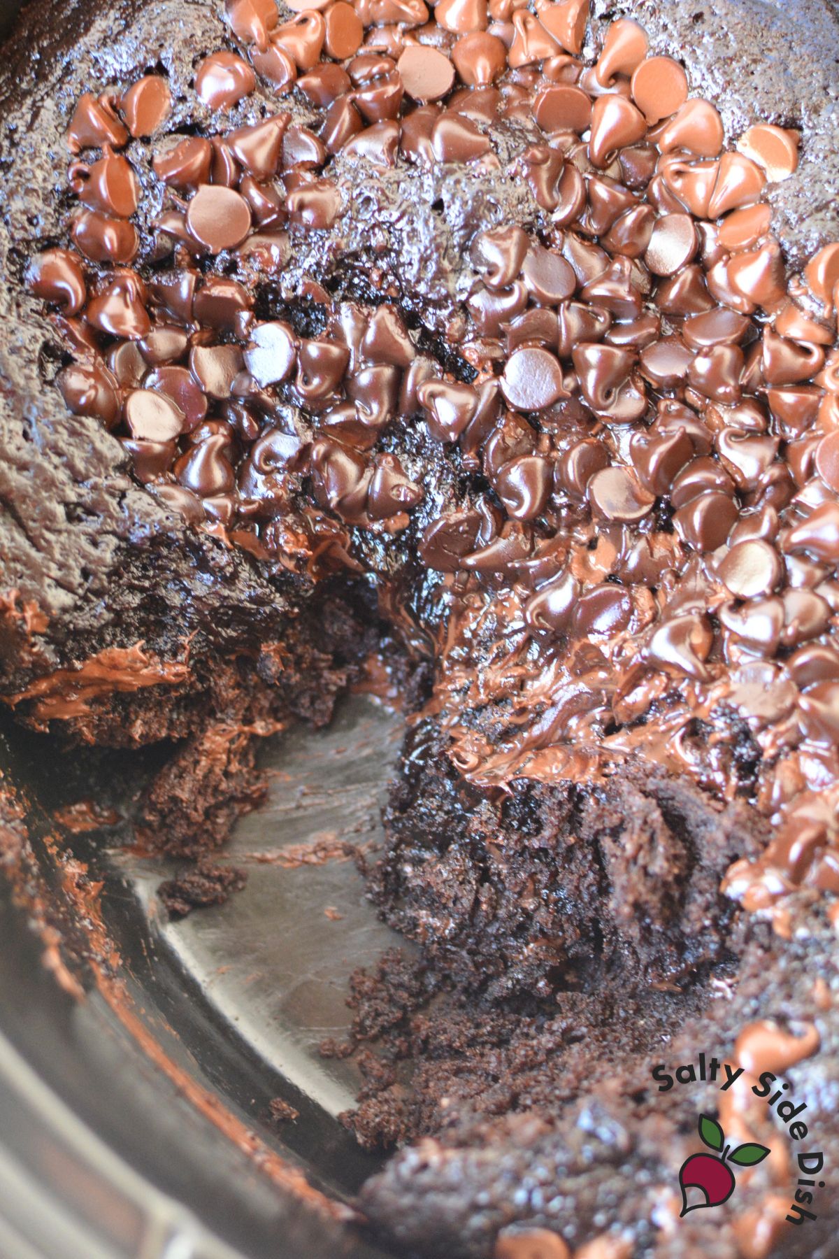 Freshly baked molten chocolate lava cake in slow cooker with melted chips