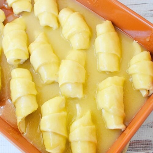 Mountain Dew soda poured into the pan of crescent roll apple dumplings