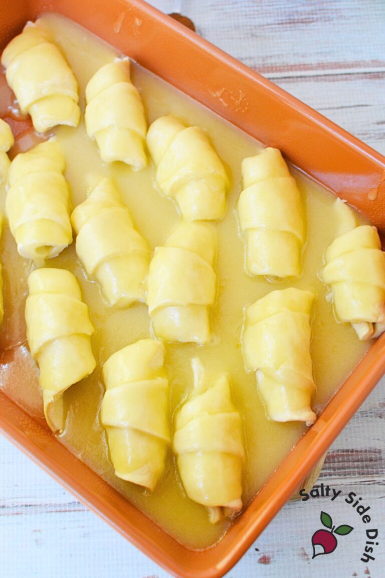 Mountain Dew soda poured into the pan of crescent roll apple dumplings