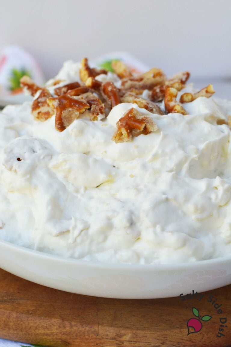 Close up of pineapple pretzel fluff salad with crunchy pretzels folded into creamy pineapple filling