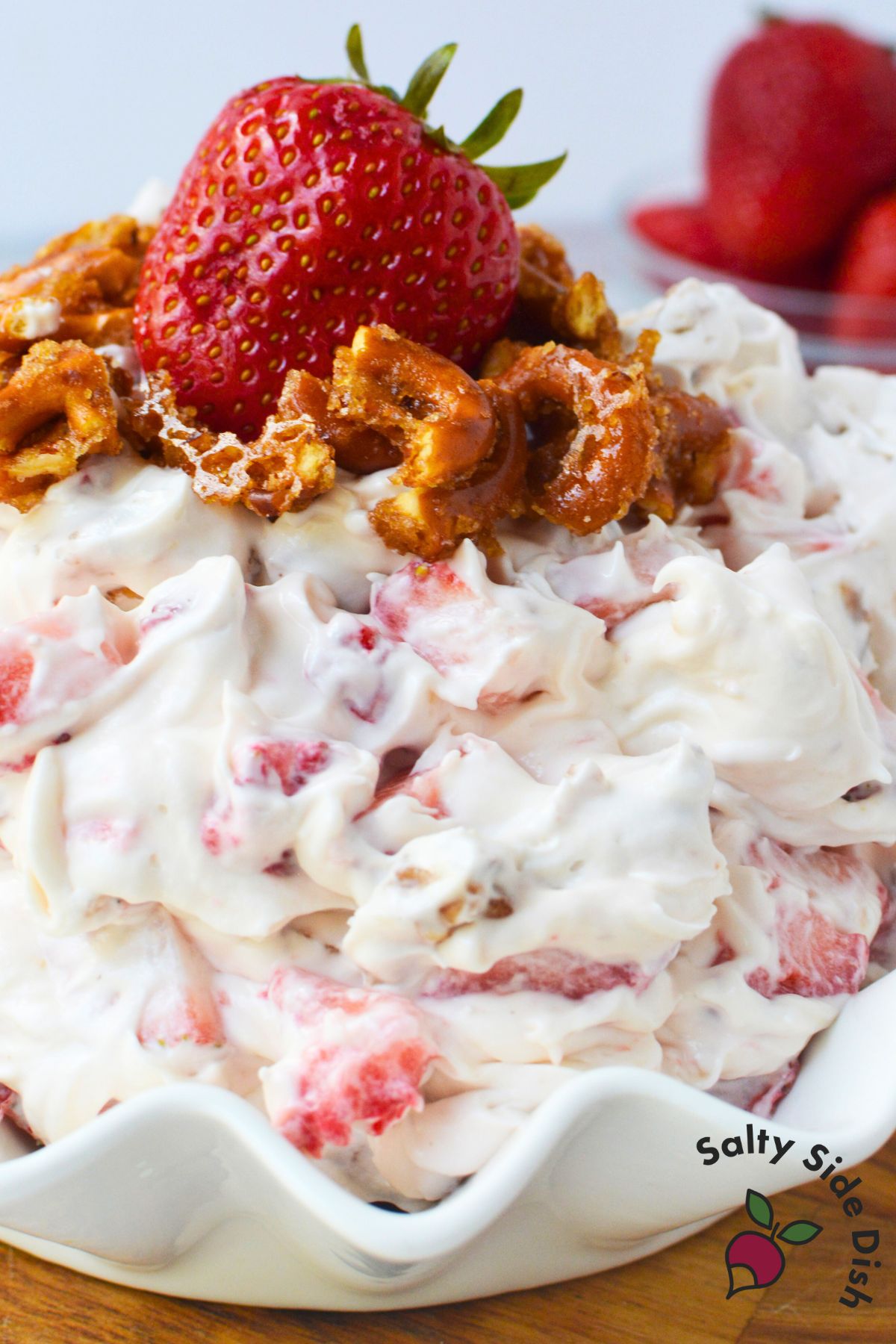 Easy holiday side dish dessert salad with whipped topping, pretzels, and strawberries