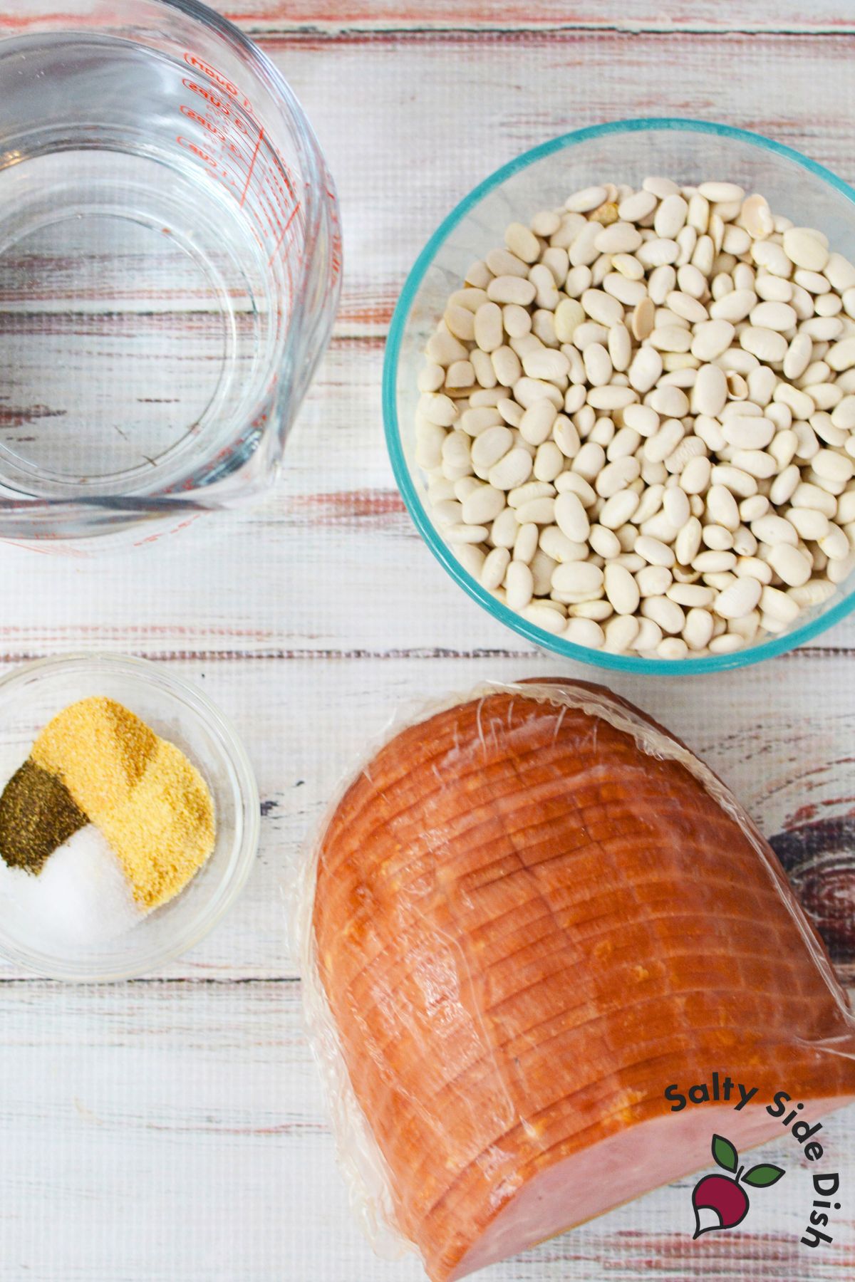 Ingredients for slow cooker ham and beans including dried great northern beans, diced ham, water, and spices