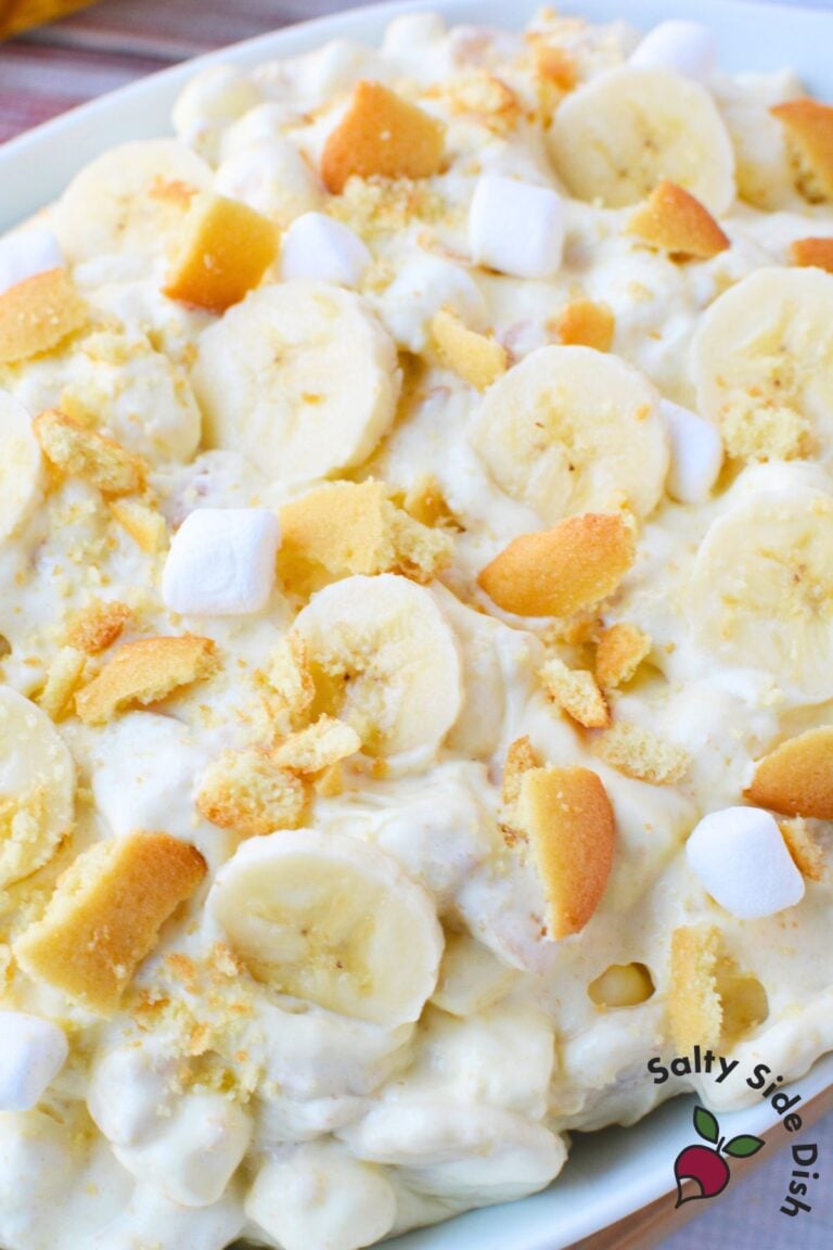 Banana pudding fluff dessert with fresh banana slices and crushed Nilla wafers mixed throughout.