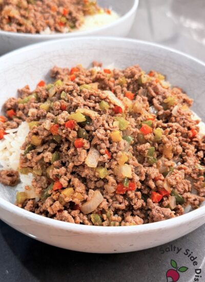 Ground beef and pepper rice bowl served over jasmine rice with colorful diced peppers and onions
