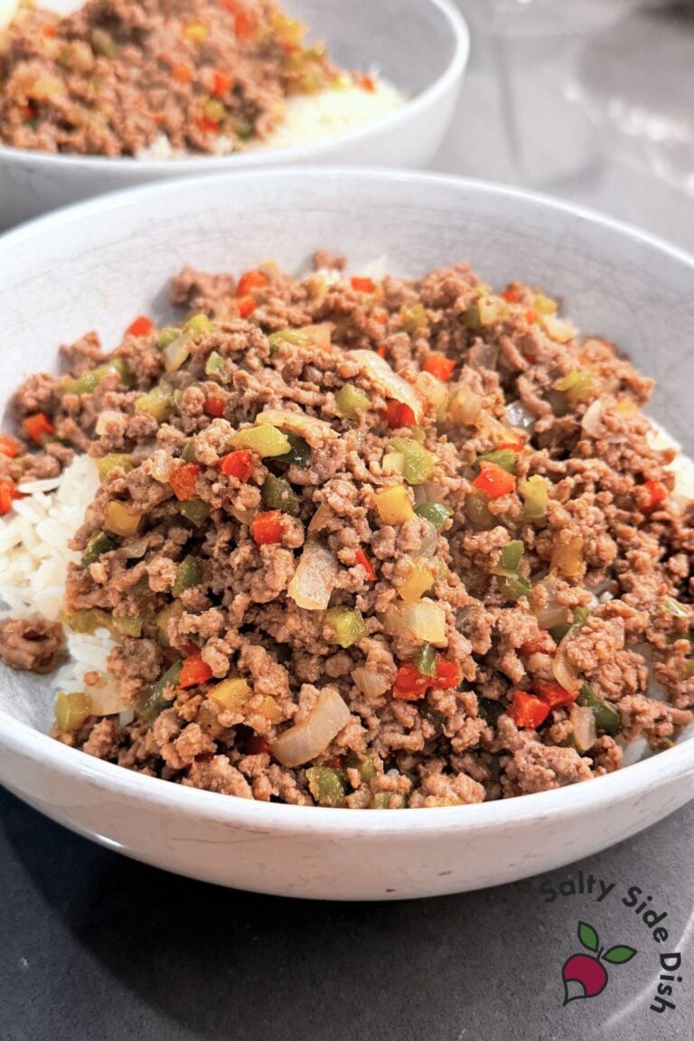 Ground beef and pepper rice bowl served over jasmine rice with colorful diced peppers and onions