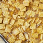 mini saltine crackers baked in caramelized brown sugar mixture for sweet and salty snack recipe