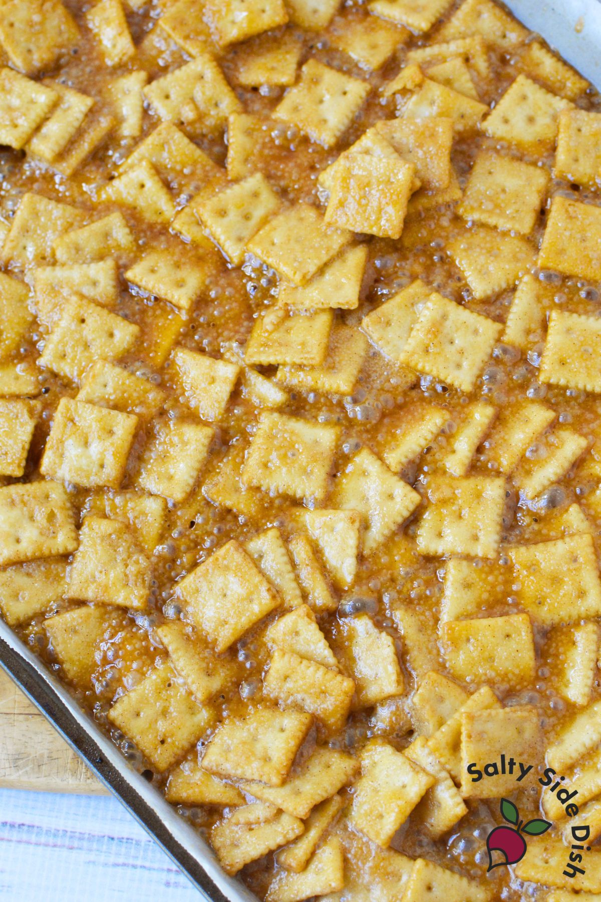 mini saltine crackers baked in caramelized brown sugar mixture for sweet and salty snack recipe