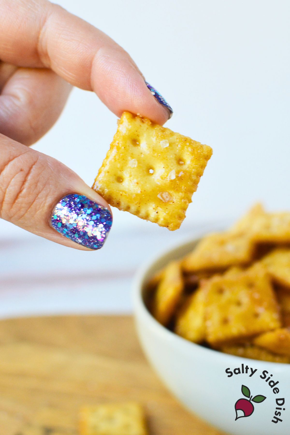 salted caramel mini crackers cooling on baking sheet, perfect for holiday snack mix or edible gifts