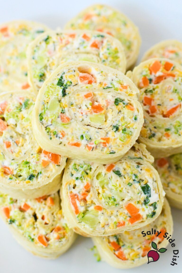 Stack of fresh vegetable pinwheels on a plate, ready to serve as an easy make-ahead appetizer for parties and holidays.