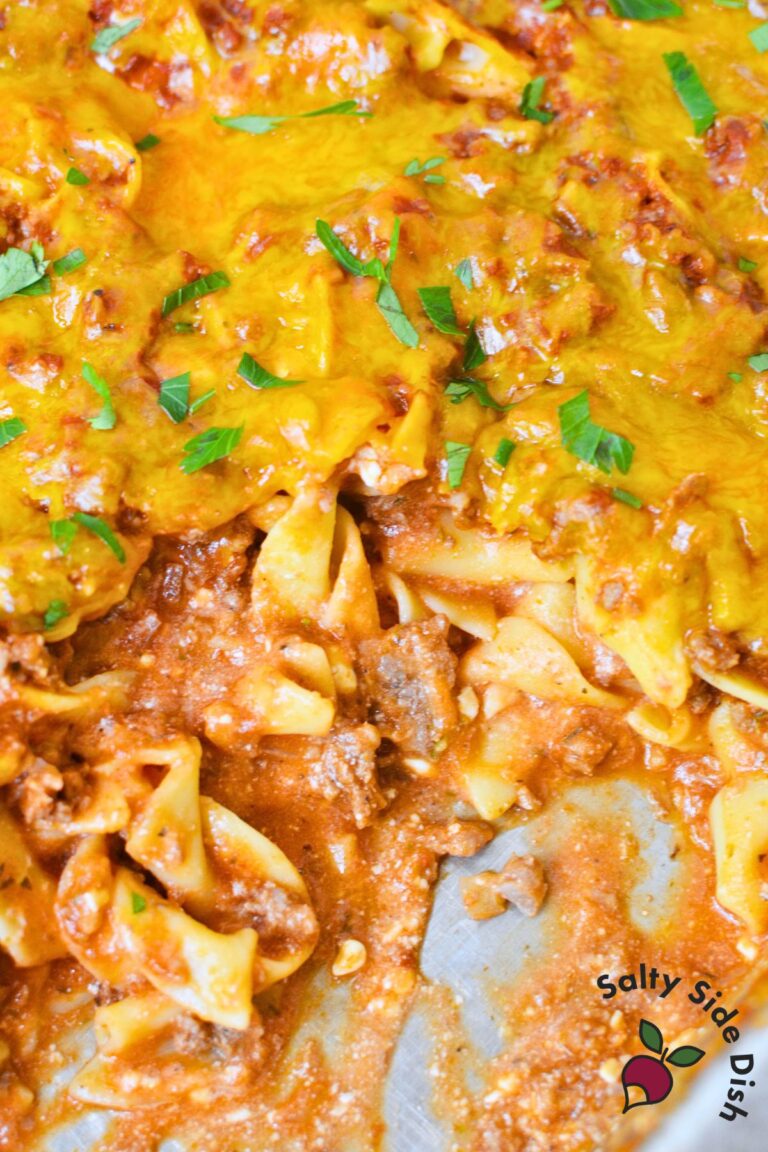 saucy tomato beef noodle casserole showing creamy noodles and ground beef
