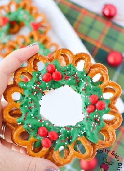 Finished chocolate pretzel wreath for Christmas on a white serving platter