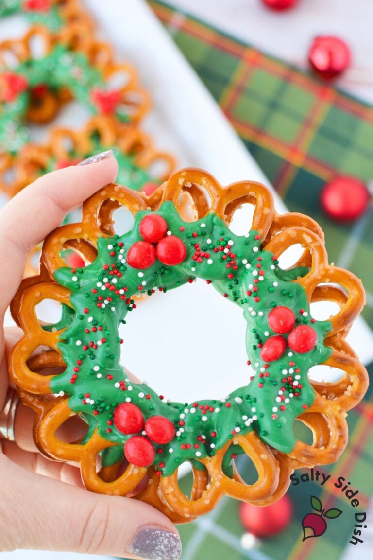 Finished chocolate pretzel wreath for Christmas on a white serving platter
