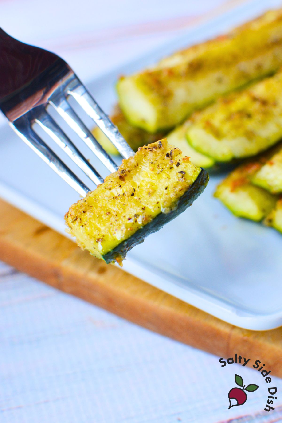 bite of parmesan zucchini on a fork