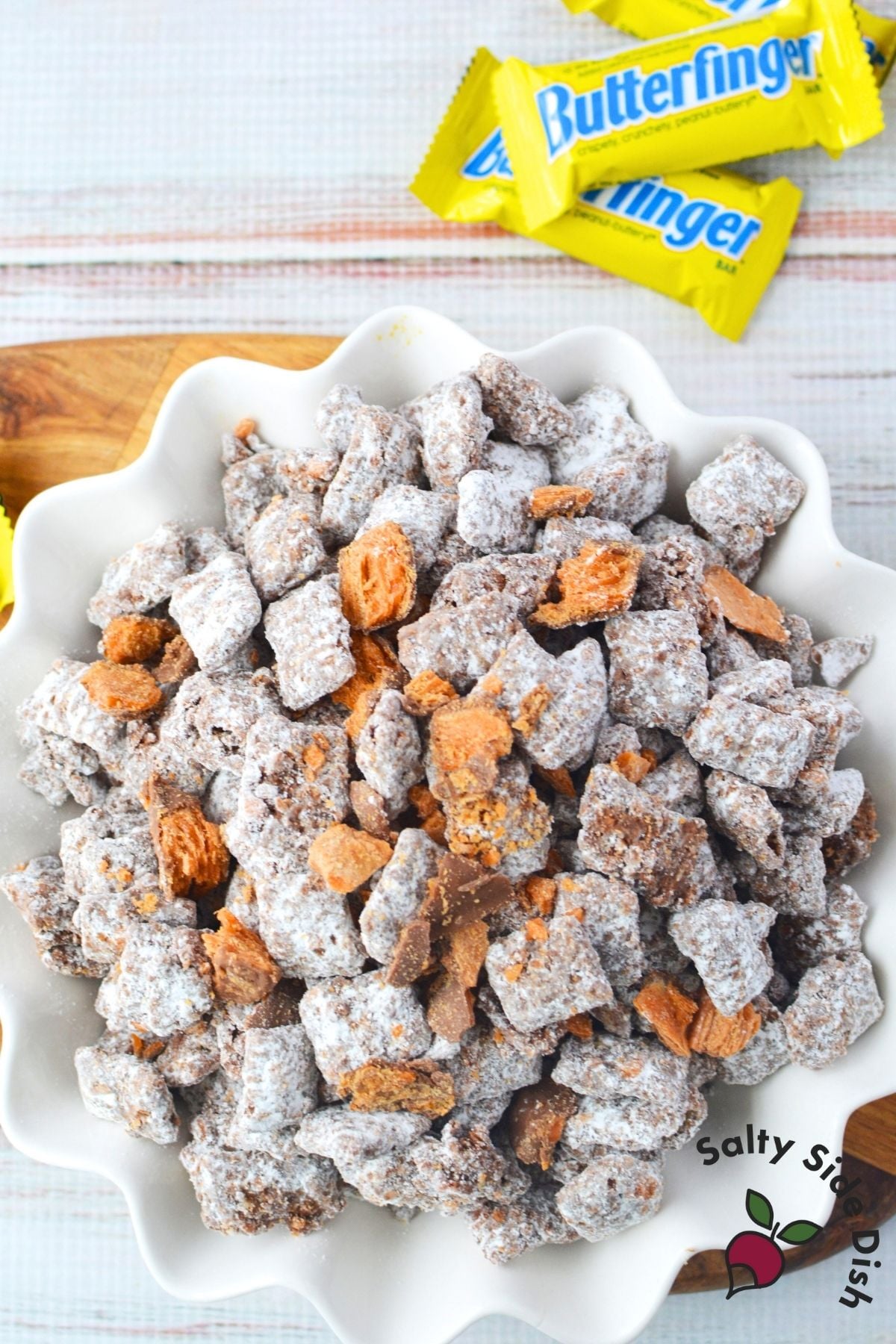 Close up of Butterfinger puppy chow with chocolate, peanut butter, and powdered sugar coating