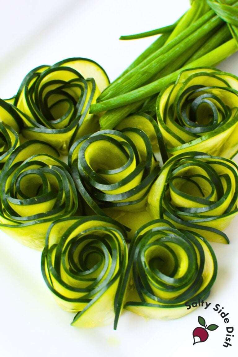 Cucumber roses arranged on a plate as a decorative garnish for charcuterie boards
