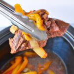 Tender sirloin steak and bell peppers cooked in the slow cooker with soy sauce and beef broth