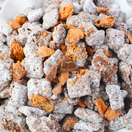 Easy no bake Butterfinger puppy chow recipe in a serving bowl