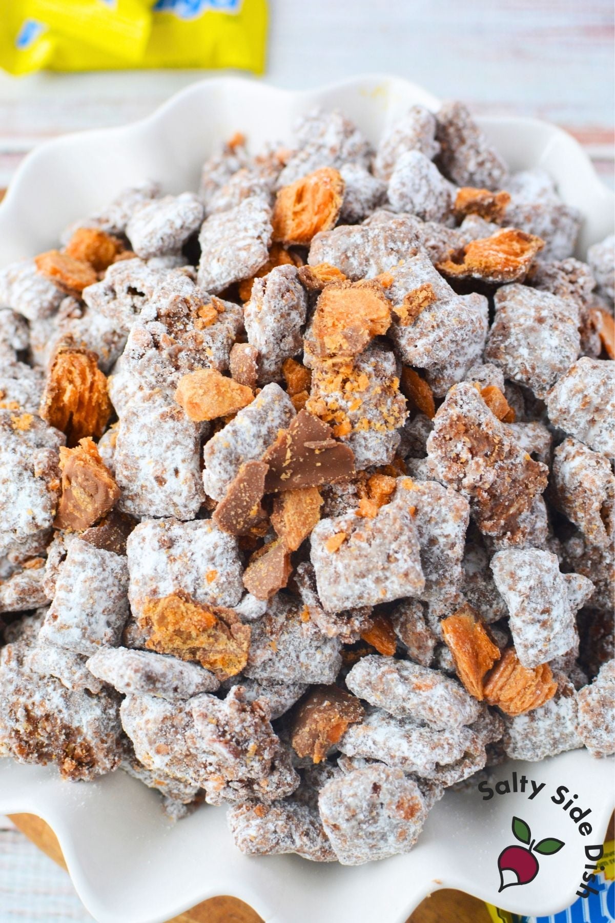 Easy no bake Butterfinger puppy chow recipe in a serving bowl