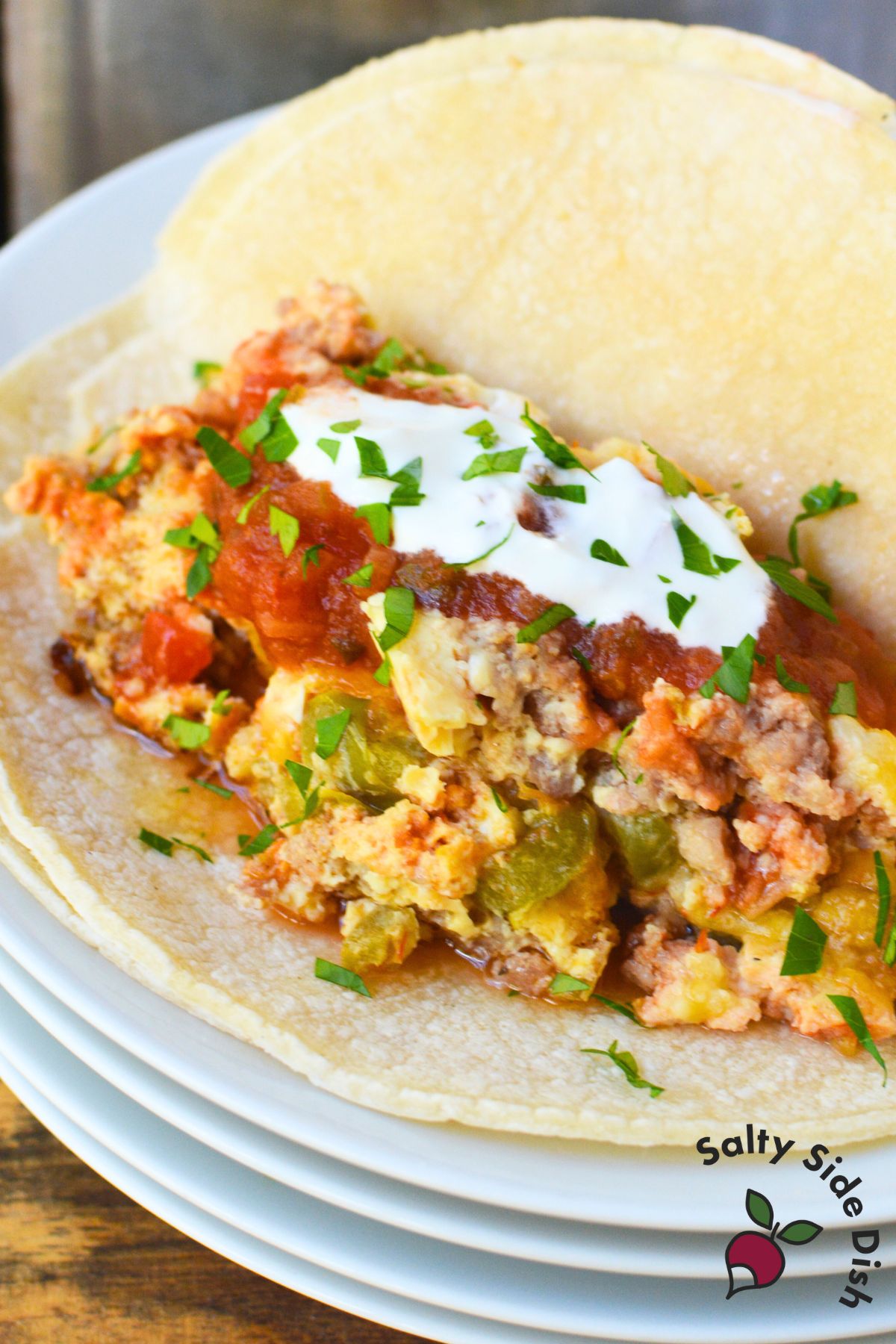 How to cook eggs in a slow cooker for breakfast burritos using sausage, salsa, and cheese
