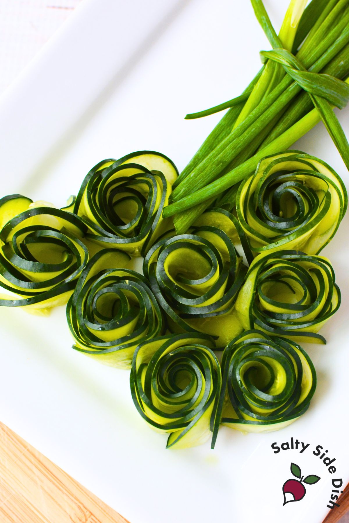 Step by step process showing how to make cucumber roses from thin slices