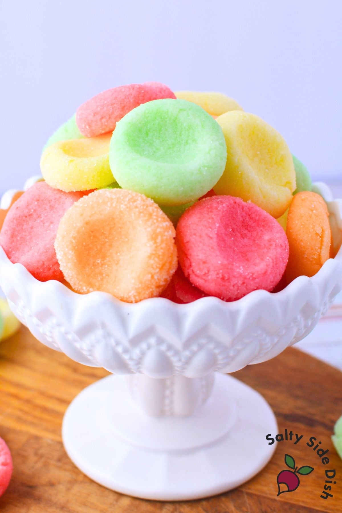 Bowl filled with assorted jello candy melts coated in granulated sugar