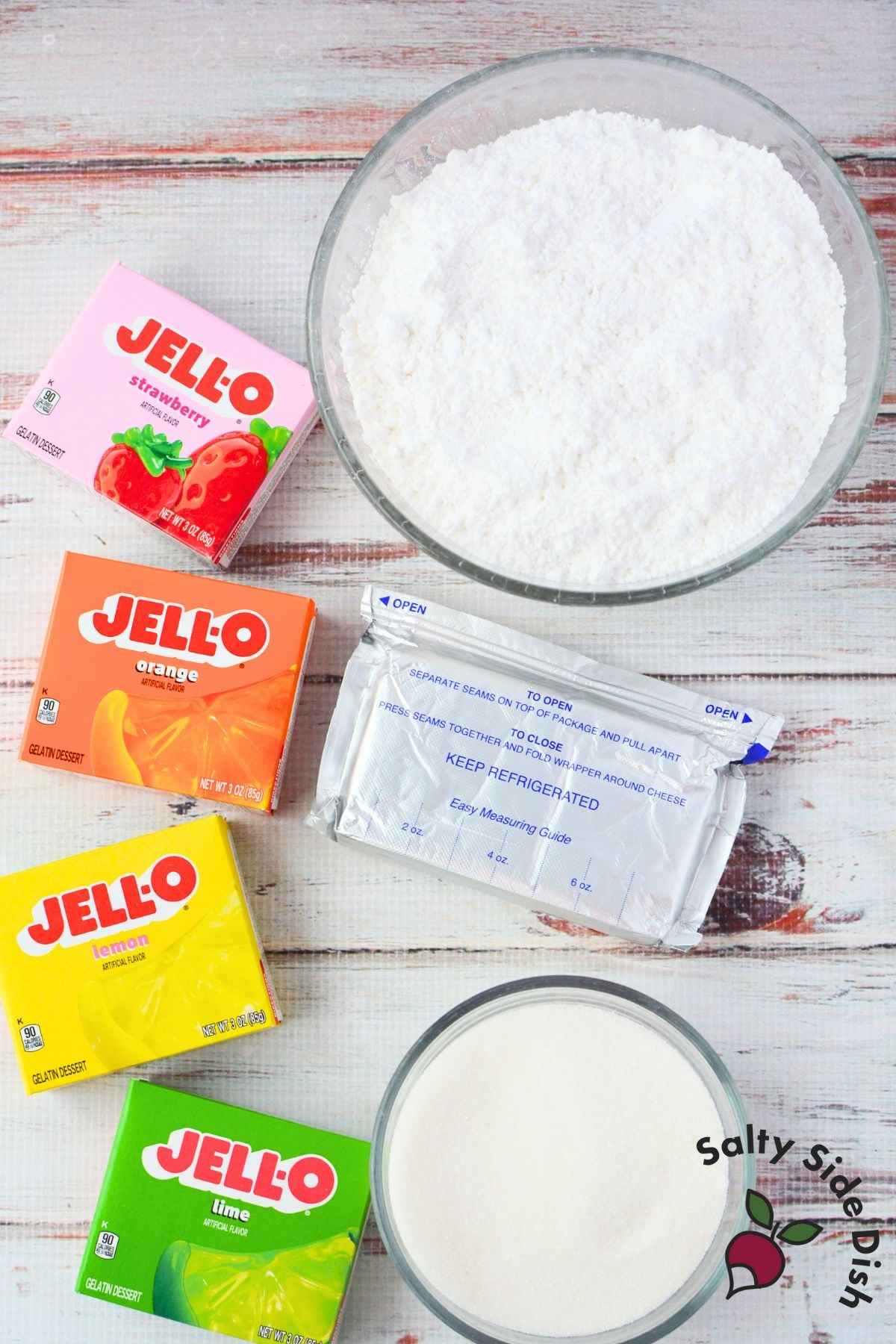 Ingredients for jello candy melts including cream cheese, powdered sugar, granulated sugar, and jello packets