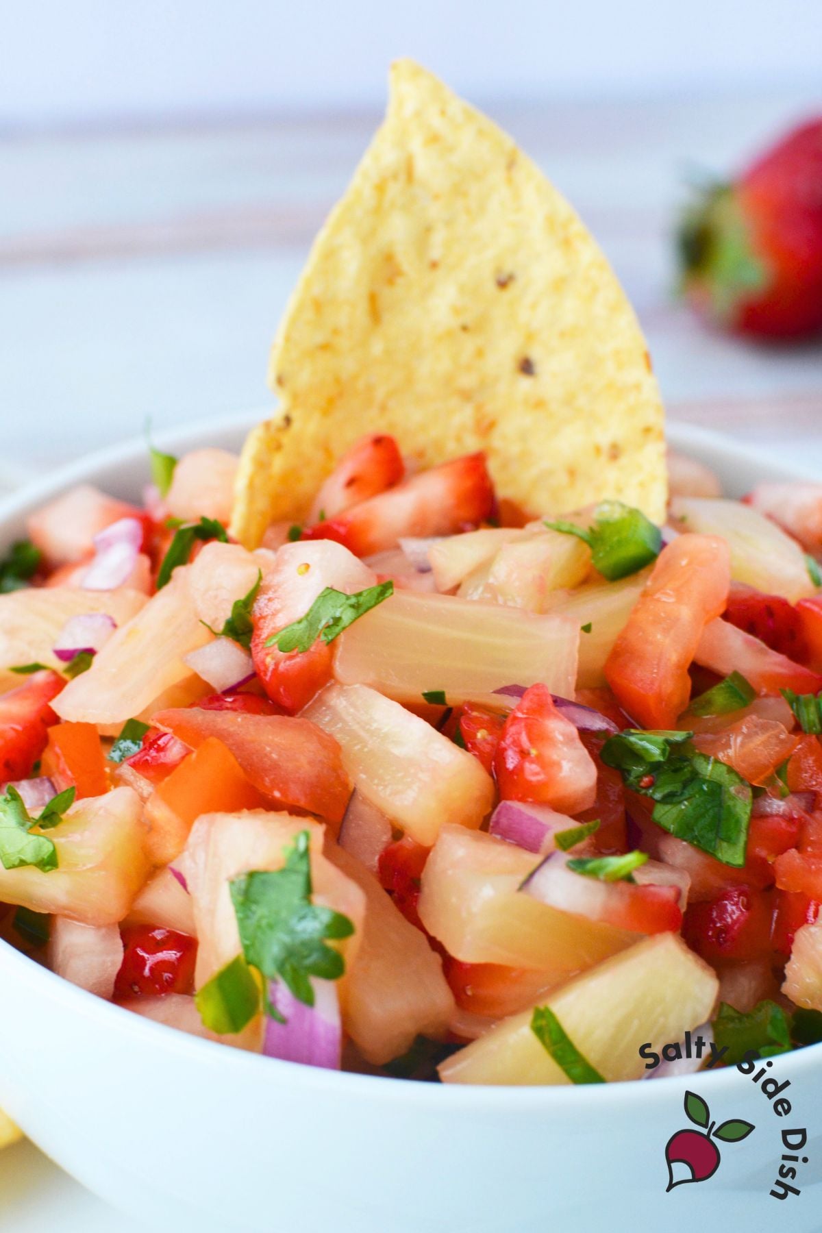 Close-up of strawberry pineapple salsa showing fresh fruit and vegetables