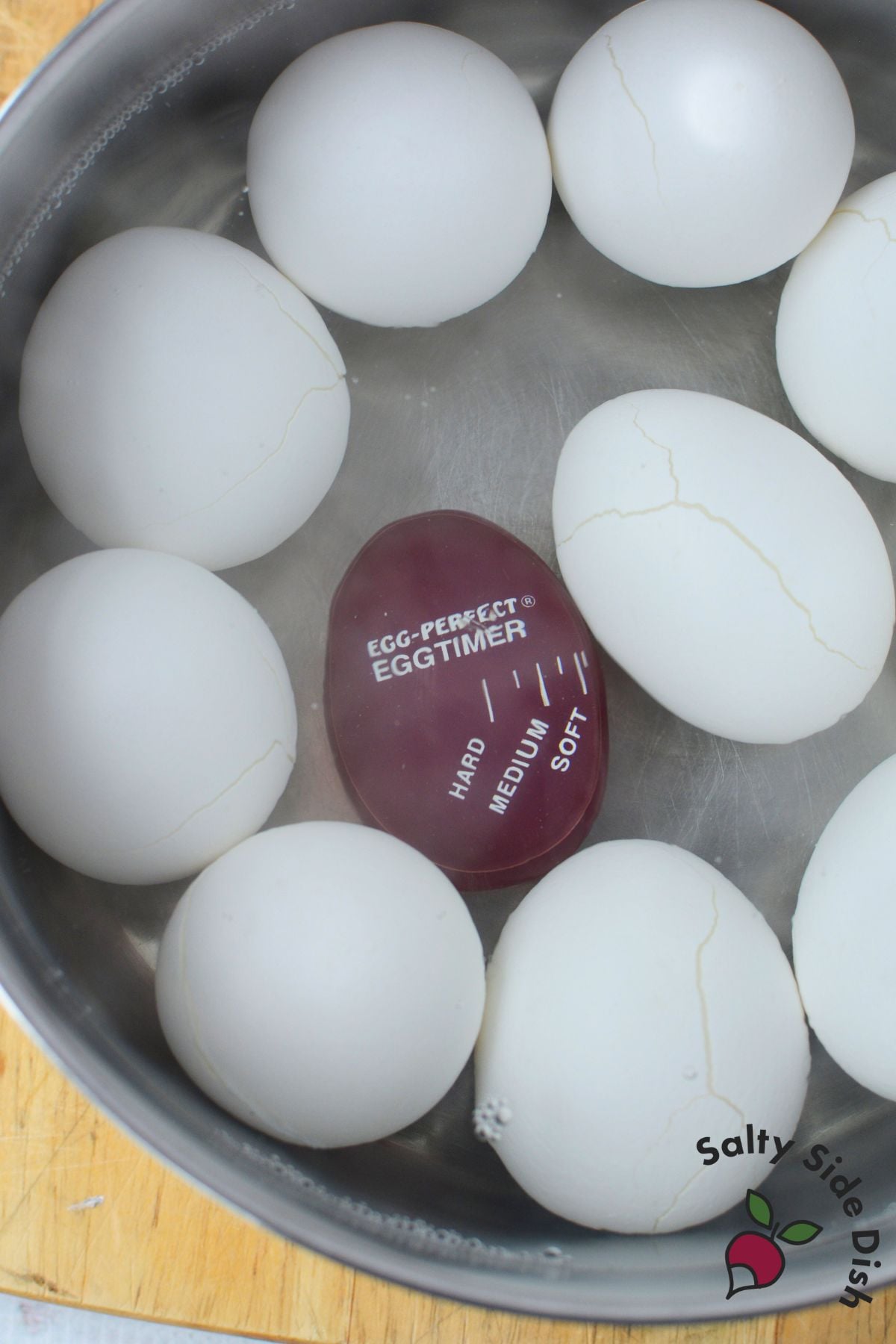 eggs with cracked shells in pot of water before boiling to make deviled eggs easier to peel
