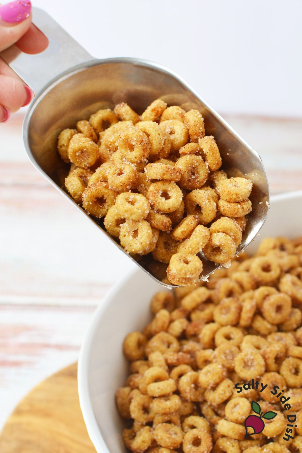 close up of buttery cinnamon sugar Cheerios coated evenly after stovetop cooking