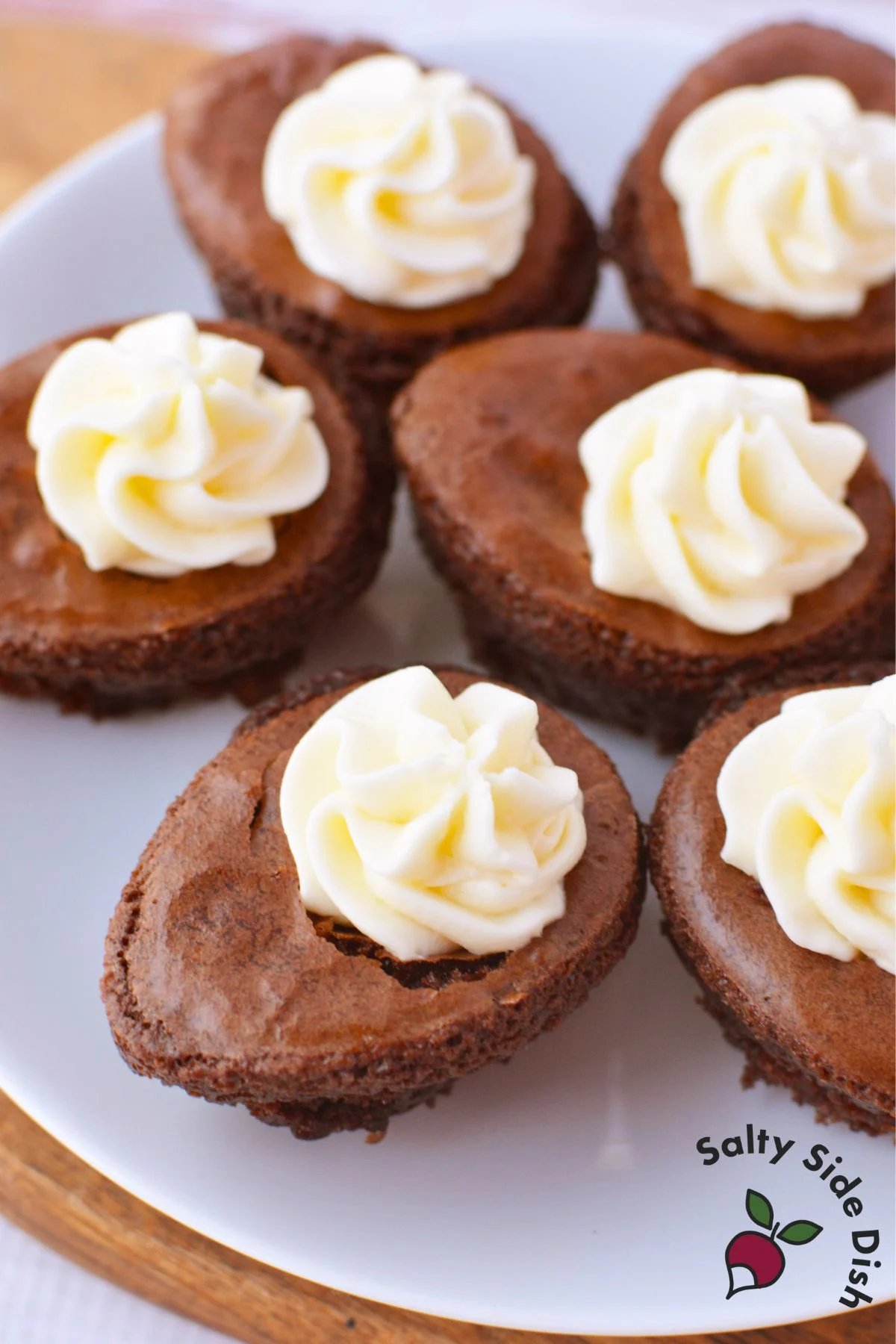 Plate of deviled brownies filled with cream cheese frosting and ready to serve