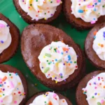 Deviled brownies topped with cream cheese filling and colorful sprinkles for Easter