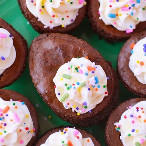 Deviled brownies topped with cream cheese filling and colorful sprinkles for Easter