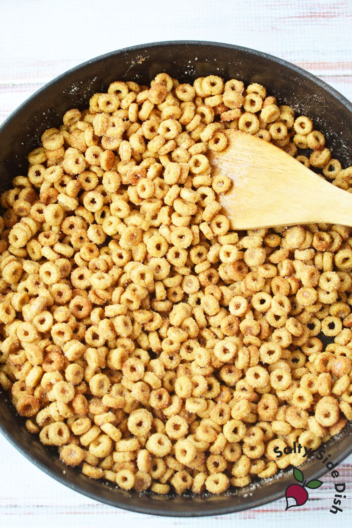 close up of buttery cinnamon sugar Cheerios coated evenly after stovetop cooking