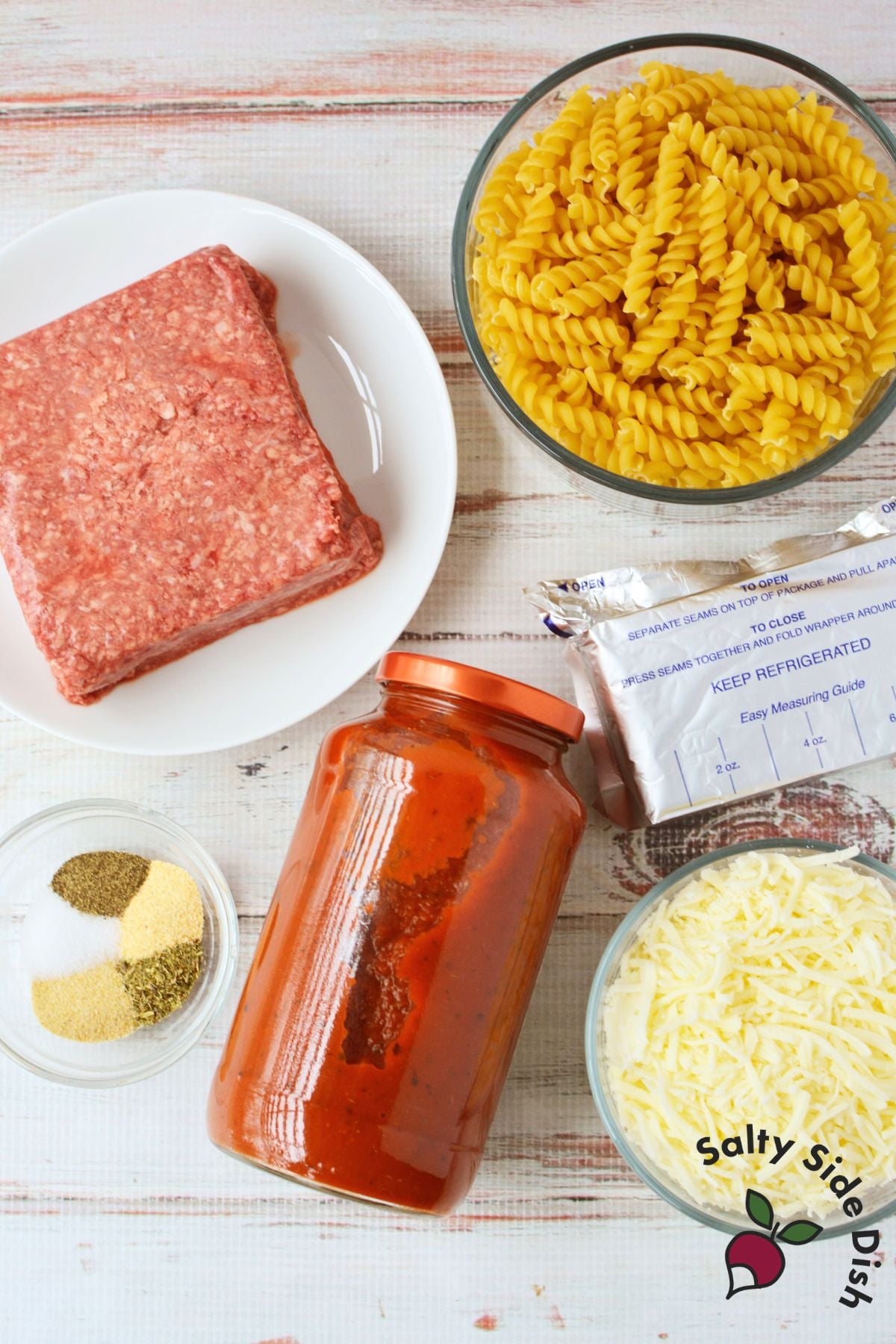 viral cheesy pasta with ground beef showing cheese pull from cast iron skilletviral cheesy pasta with ground beef showing cheese pull from cast iron skillet