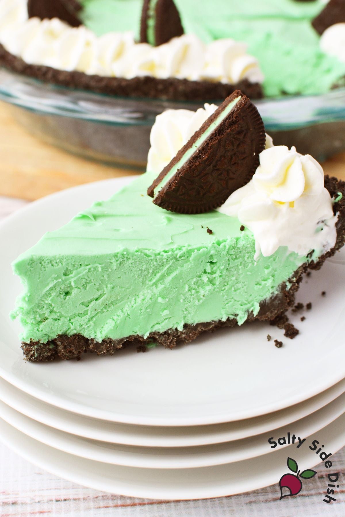 grasshopper pie slice topped with whipped cream and mint oreo