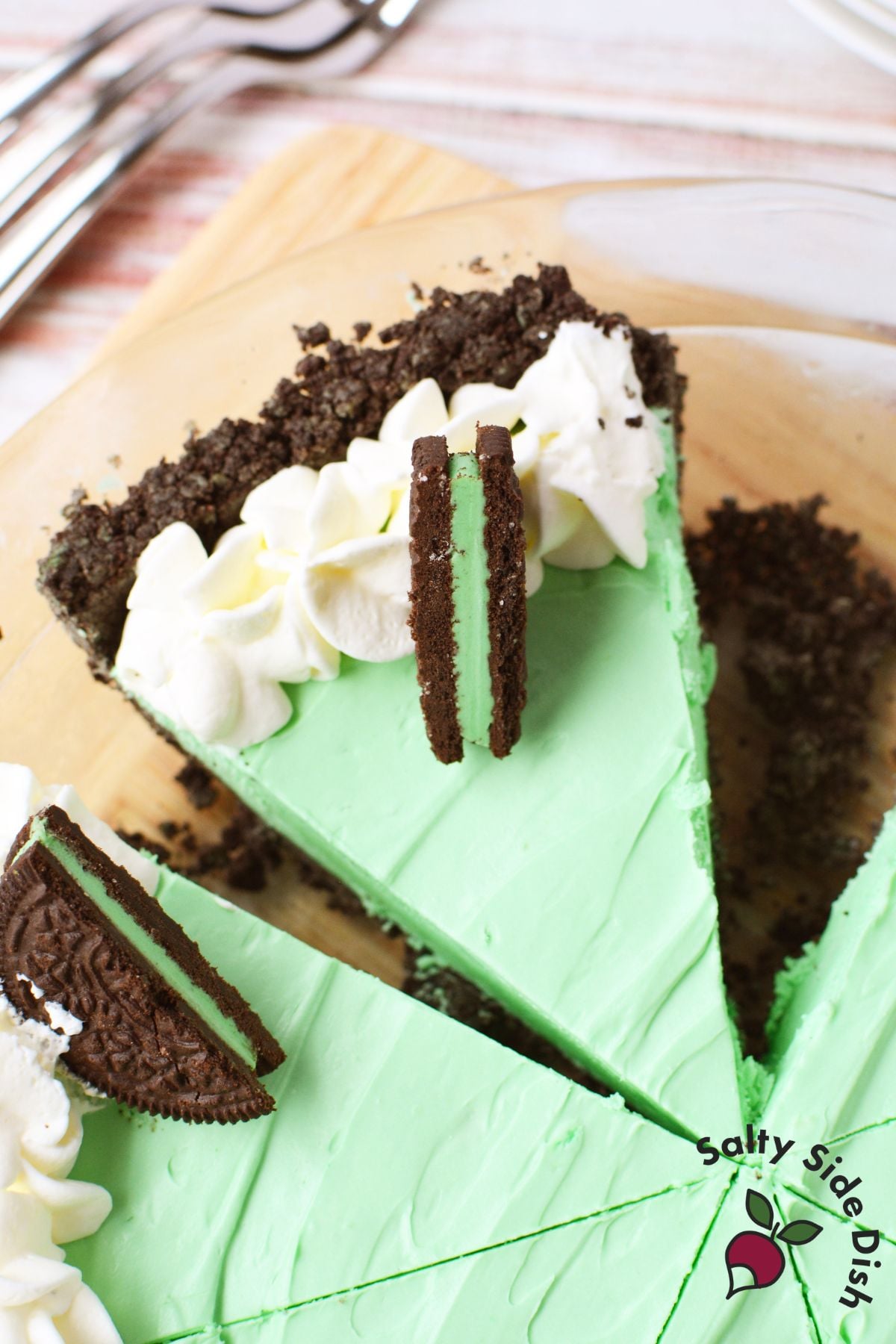 multiple slices cut from grasshopper pie in glass pie dish