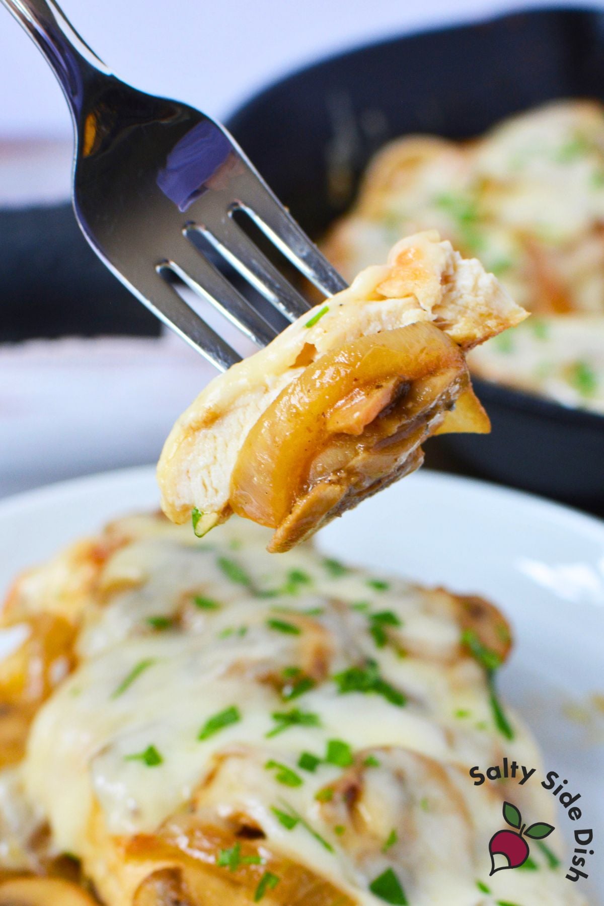bite of chicken on a fork.