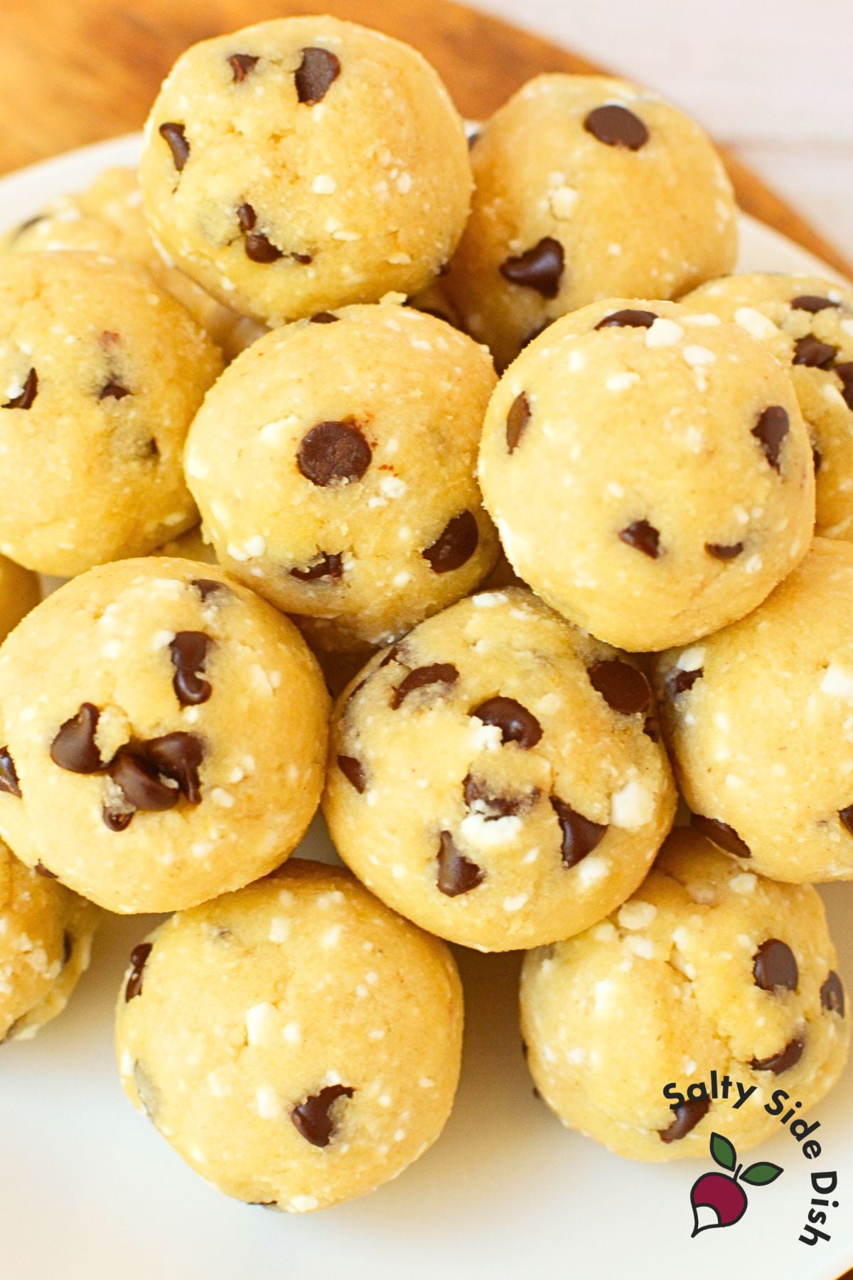 cottage cheese cookie dough balls piled on a white plate
