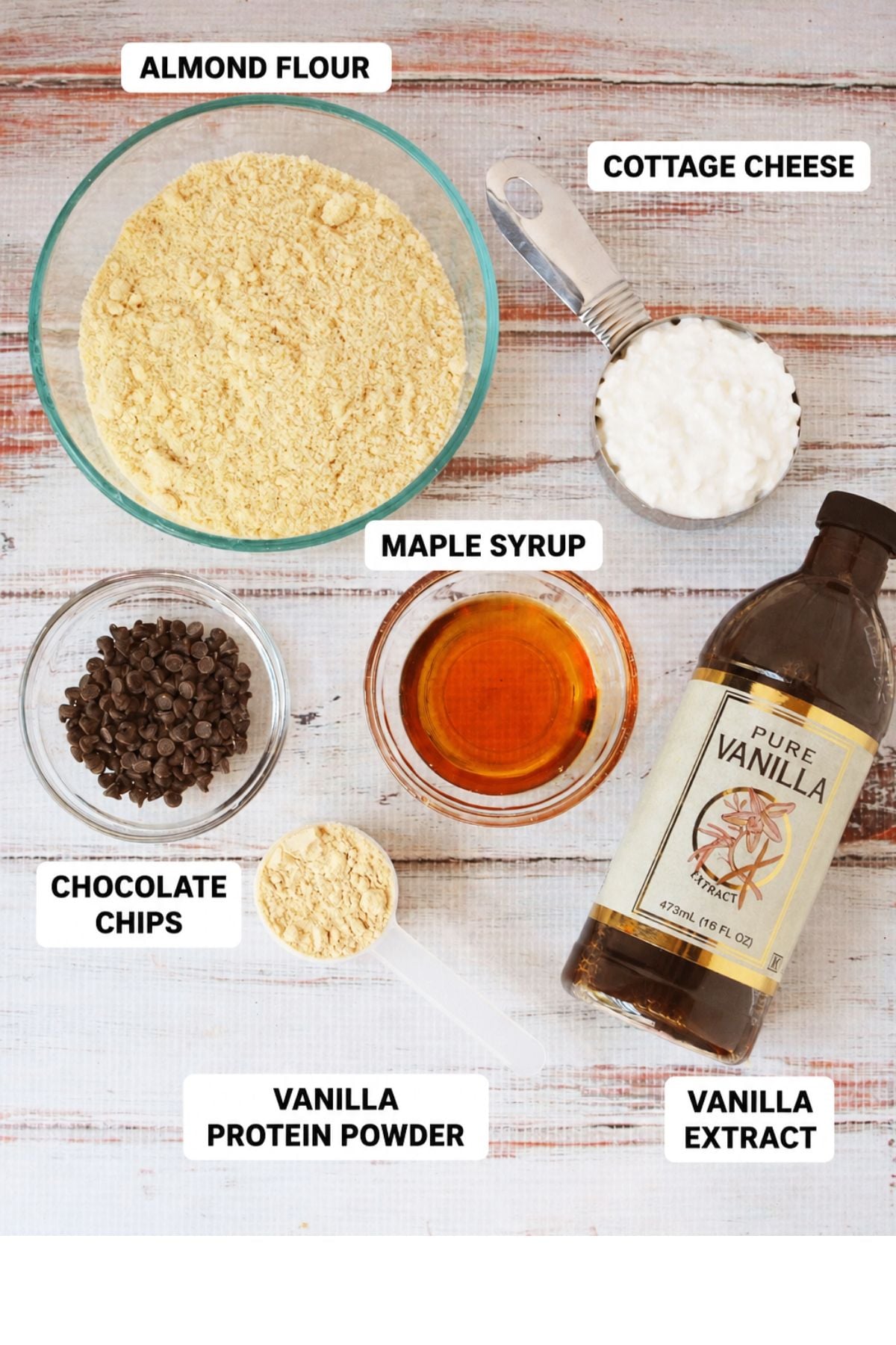 ingredients for cottage cheese cookie dough including almond flour, cottage cheese, maple syrup, vanilla protein powder, chocolate chips, and vanilla extract