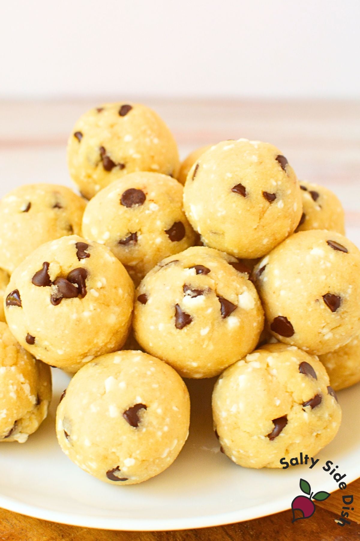 high protein cottage cheese cookie dough balls with chocolate chips on a white plate