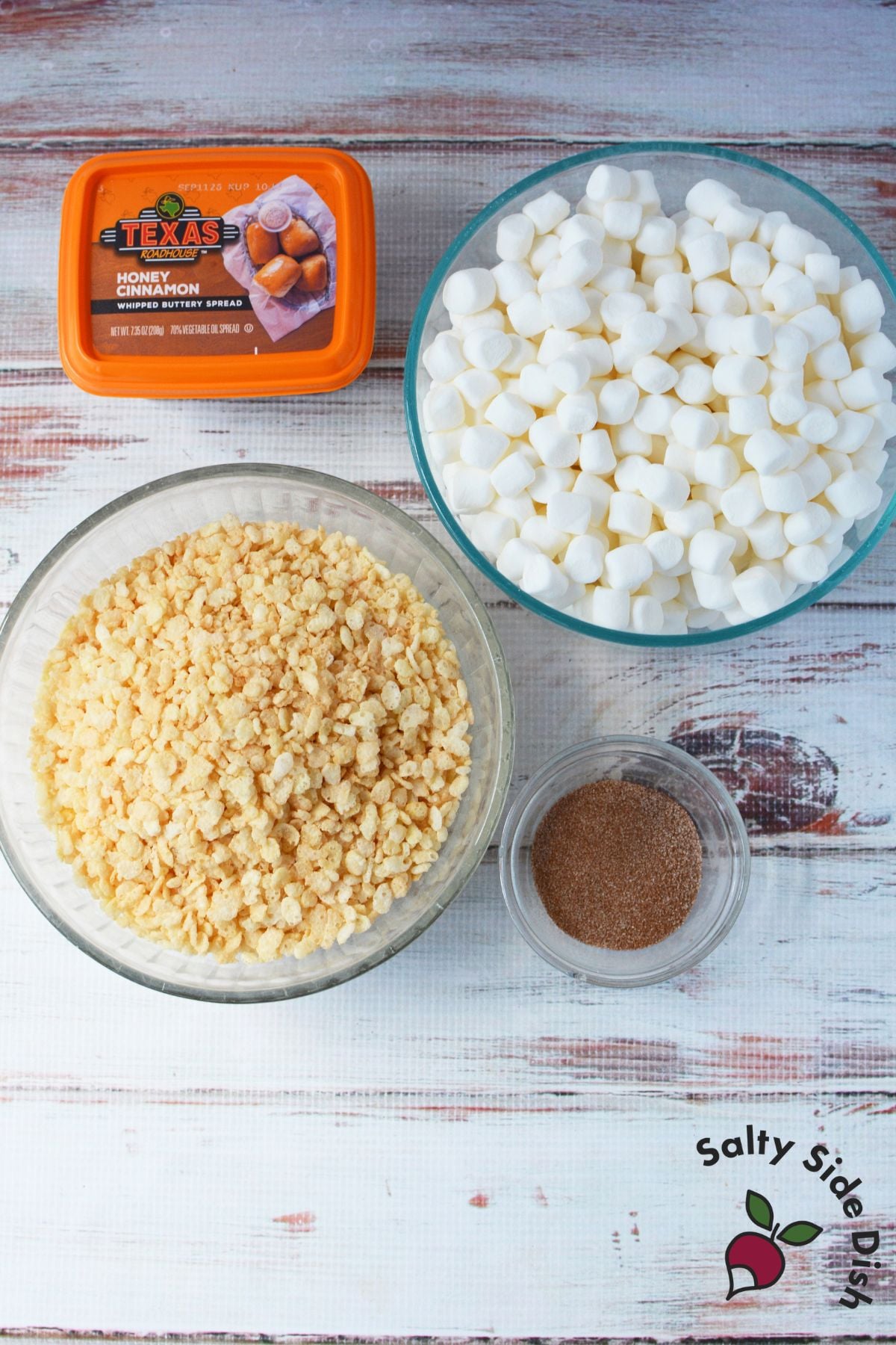 Ingredients for Texas Roadhouse Rice Krispie Treats including honey cinnamon butter, mini marshmallows, Rice Krispies cereal, and cinnamon sugar