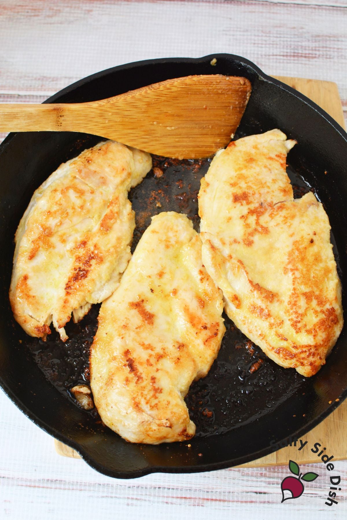 sautéing chicken in a cast iron pan