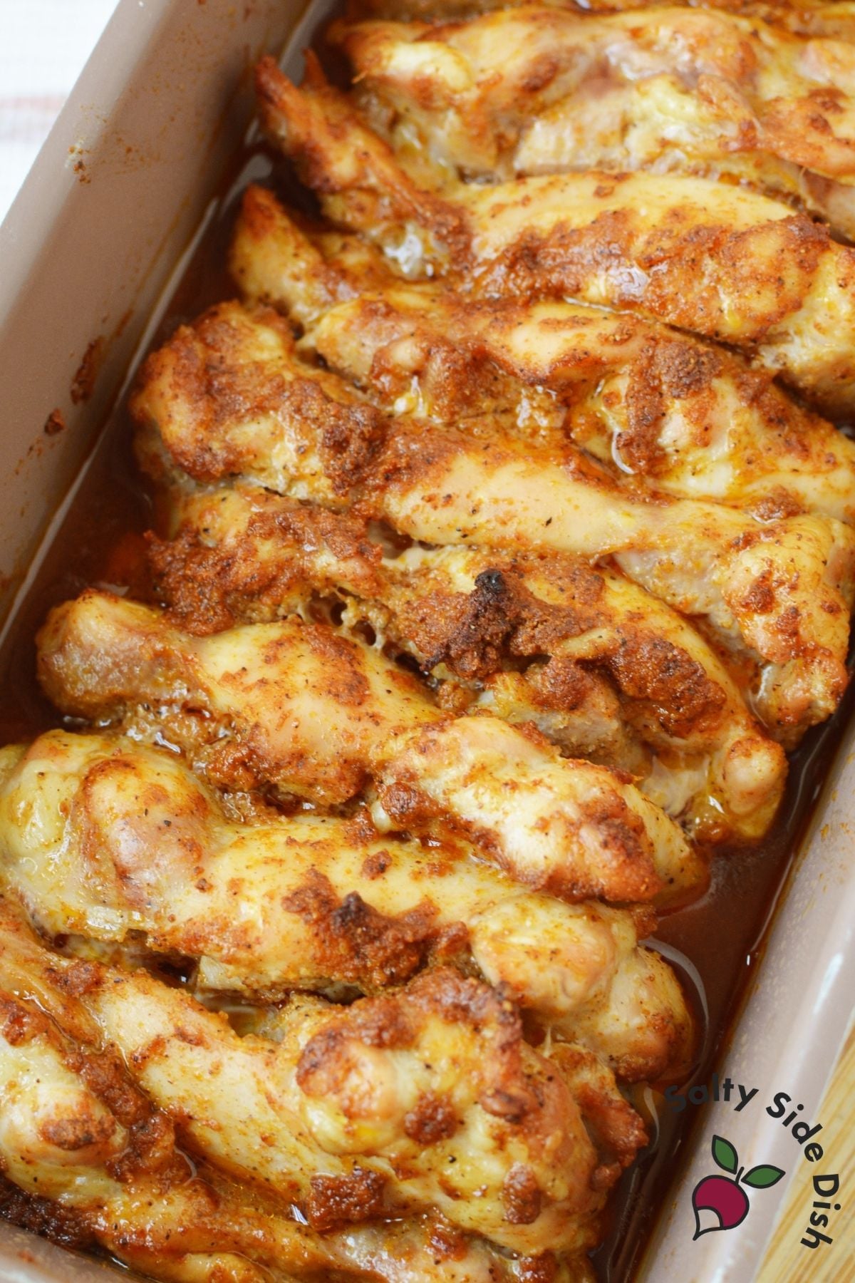 Oven baked chicken thighs cooked in a loaf pan with pan juices