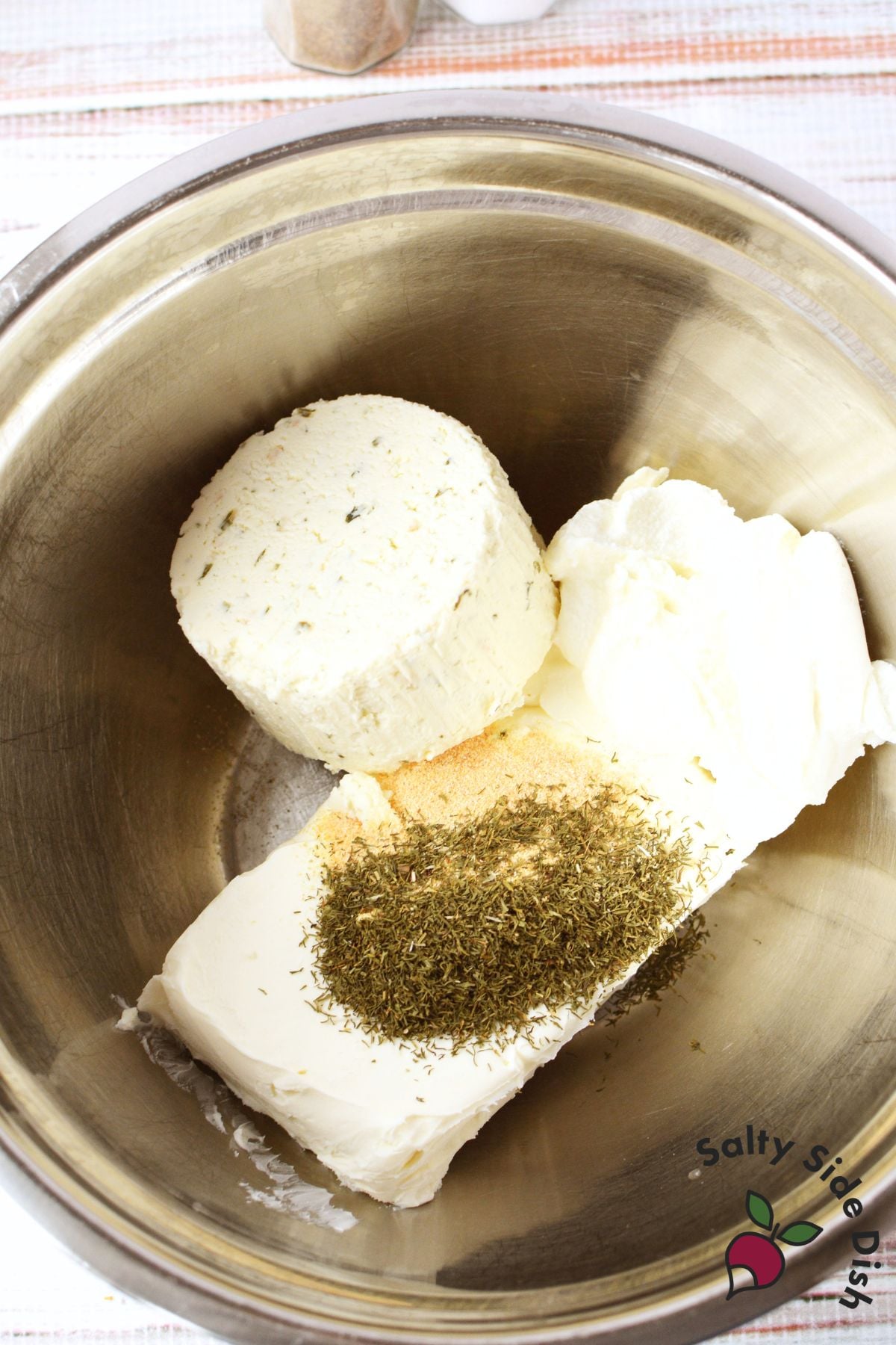 cream cheese, Boursin, ricotta, dill, and garlic powder in a mixing bowl before combining