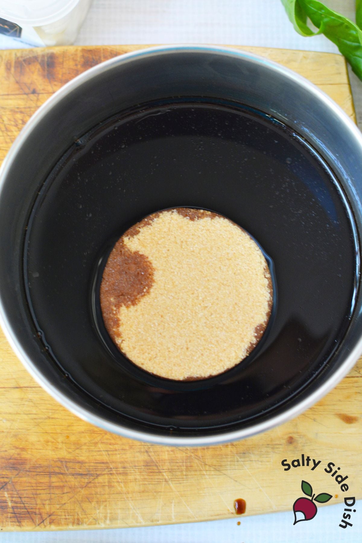Brown sugar and balsamic vinegar in a saucepan for balsamic glaze