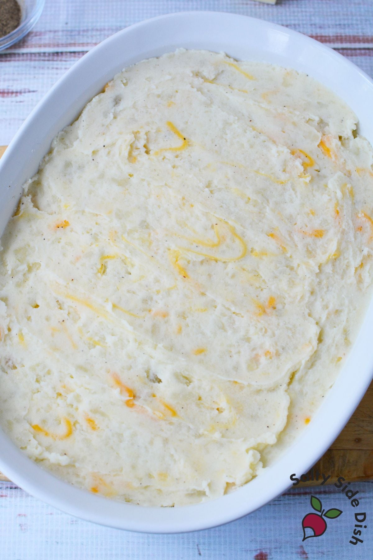 Close up of mashed potato gratin sliced open showing creamy layers