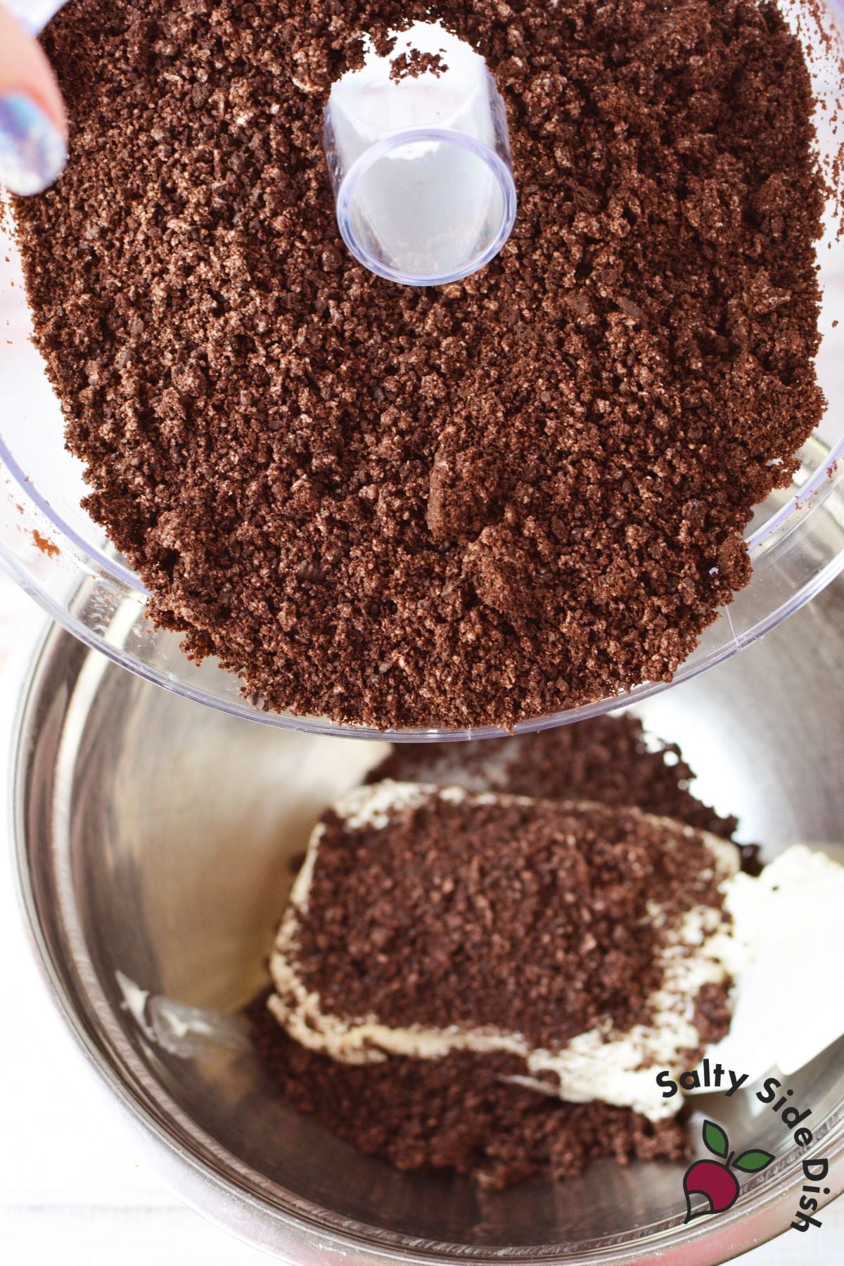 Crushed Oreo cookies being added to cream cheese to make the truffle filling.